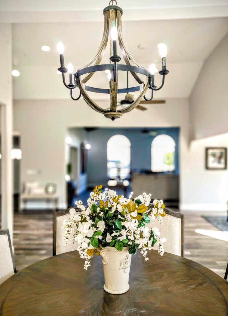 A chandelier with flowers underneath