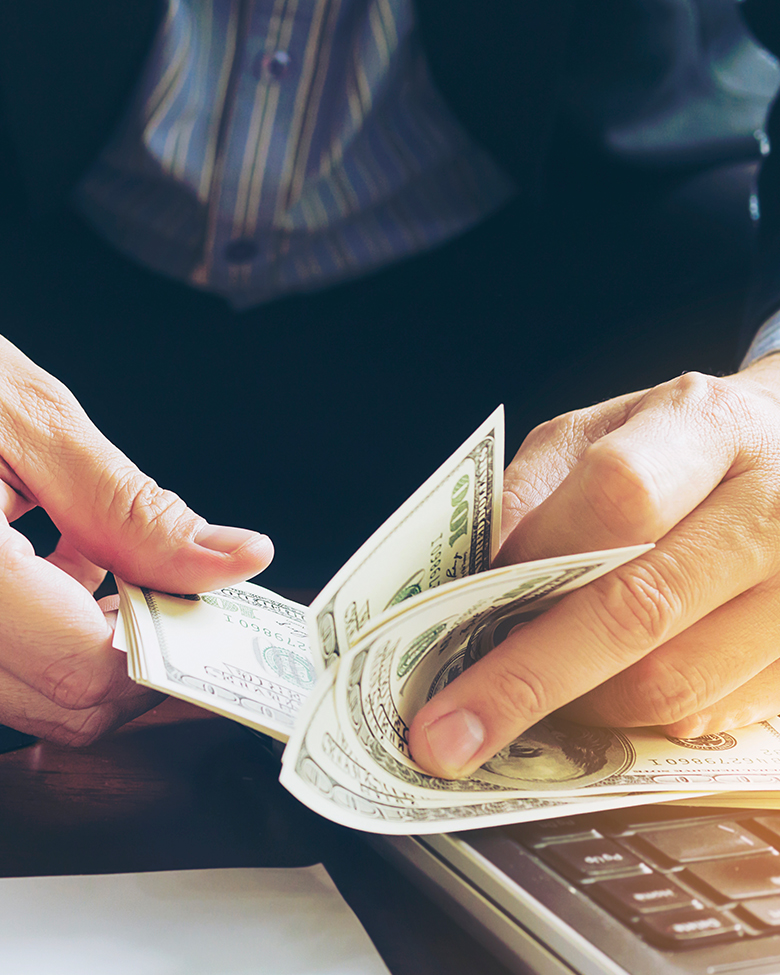 Hands holding money