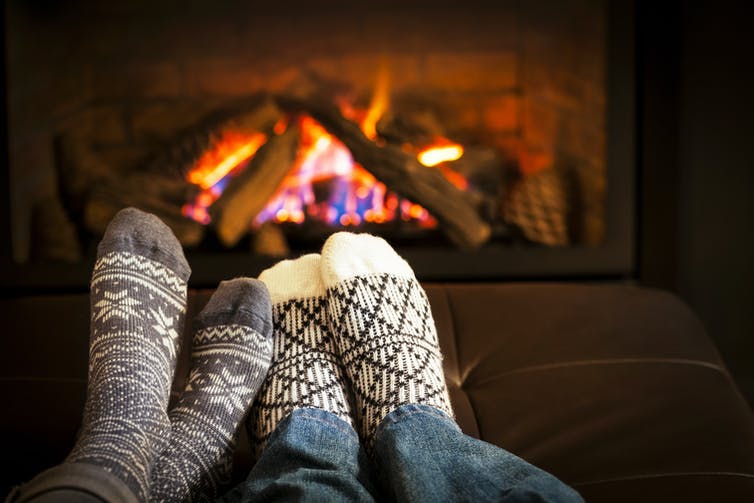 feet by a fire